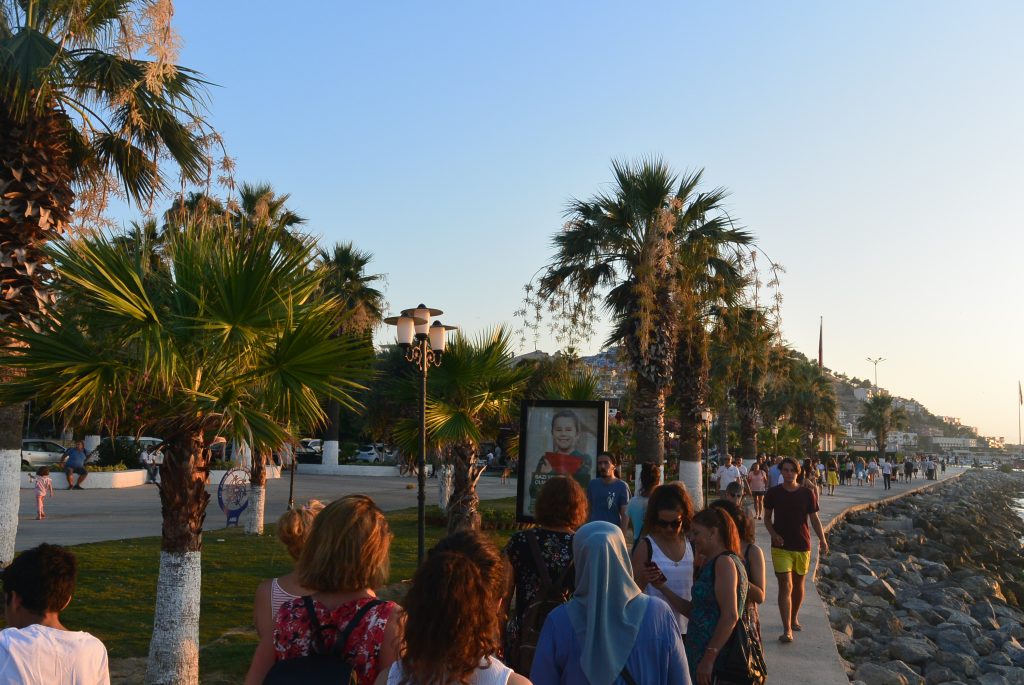 People leisurely stroll along the Kusadasi embankment