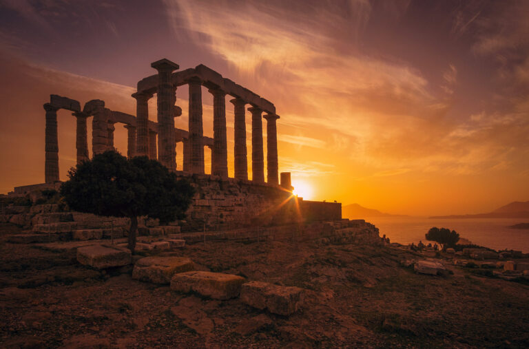 Temple of Poseidon and sunsets over the sea, Greece