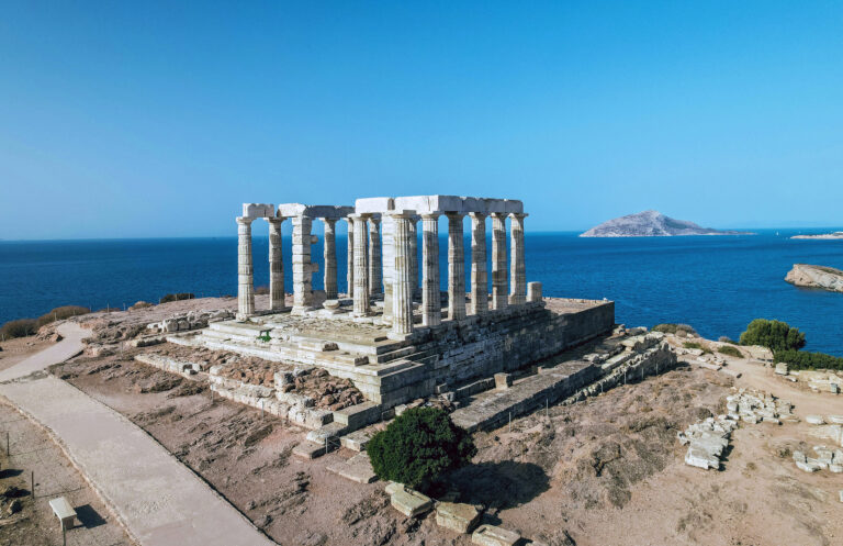 Temple of Poseidon and sunsets over the sea, Greece